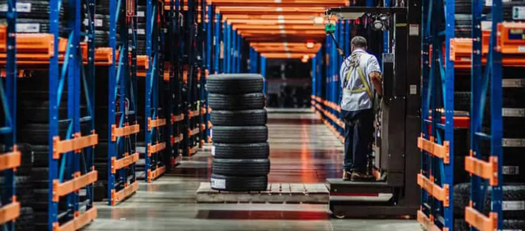 Tire Distribution warehouse with lots of shelving.