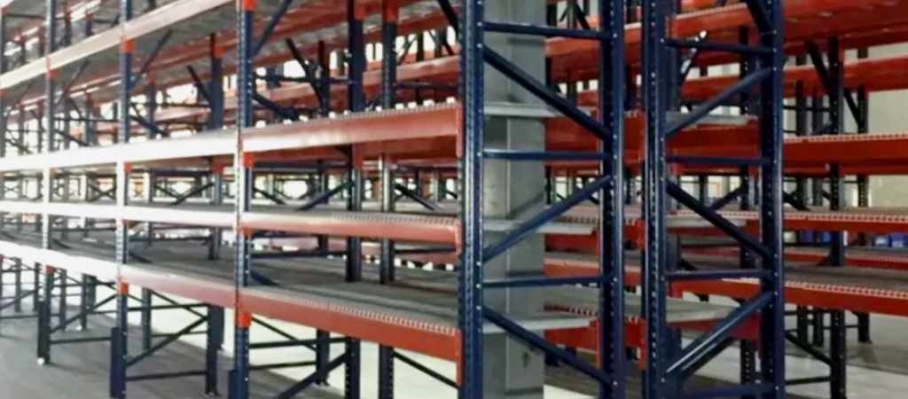 A warehouse with blue and red shelving.